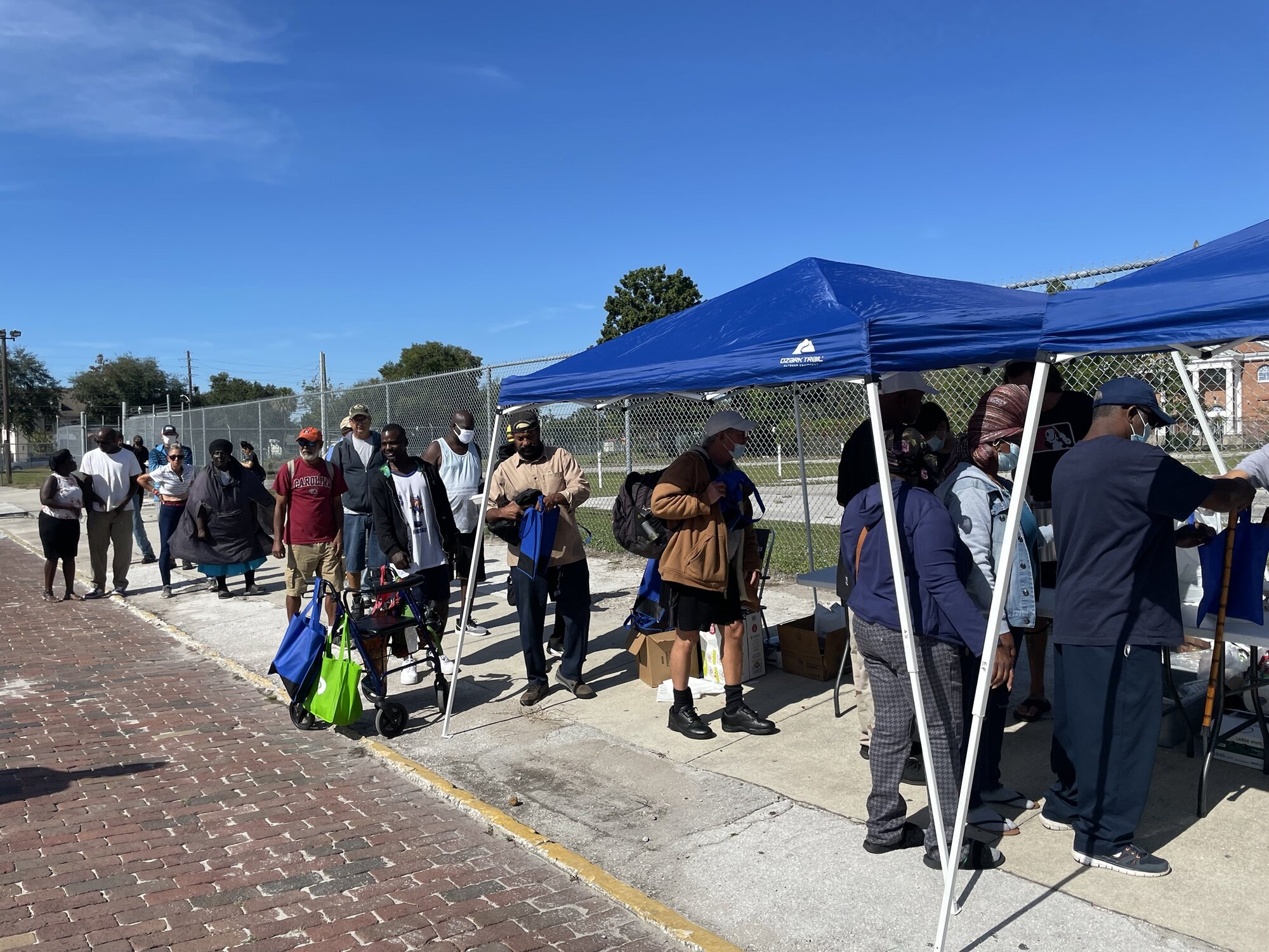 Hungry Saturday meal line under the tents in downtown Orlando