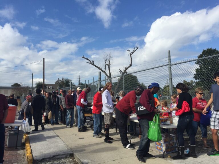 Volunteers serving neighbors at the Hungry Saturday line in Orlando
